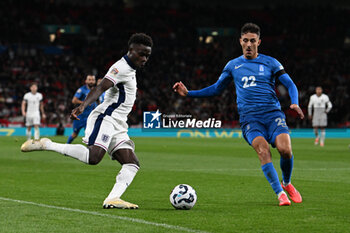 2024-10-10 - Bukayo Saka (7) of England and Dimitris Giannoulis (22) of Greece during the UEFA Nations League, League B, Group B2 football match between England and Greece on 10 October 2024 at Wembley Stadium in London, England - FOOTBALL - UEFA NATIONS LEAGUE - ENGLAND V GREECE - UEFA NATIONS LEAGUE - SOCCER