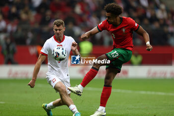 2024-10-12 - Pawel Dawidowicz of Poland and Renato Veiga of Portugal during the UEFA Nations League, League A, Group A1 football match between Poland and Portugal on 12 October 2024 at PGE Narodowy in Warsaw, Poland - FOOTBALL - UEFA NATIONS LEAGUE - POLAND V PORTUGAL - UEFA NATIONS LEAGUE - SOCCER