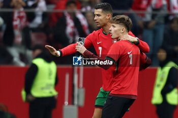 2024-10-12 - Cristiano Ronaldo of Portugal with fan during the UEFA Nations League, League A, Group A1 football match between Poland and Portugal on 12 October 2024 at PGE Narodowy in Warsaw, Poland - FOOTBALL - UEFA NATIONS LEAGUE - POLAND V PORTUGAL - UEFA NATIONS LEAGUE - SOCCER