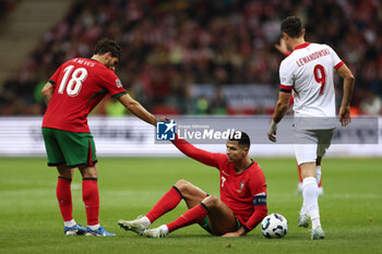 2024-10-12 - Ruben Neves, Cristiano Ronaldo of Portugal and Robert Lewandowski of Poland during the UEFA Nations League, League A, Group A1 football match between Poland and Portugal on 12 October 2024 at PGE Narodowy in Warsaw, Poland - FOOTBALL - UEFA NATIONS LEAGUE - POLAND V PORTUGAL - UEFA NATIONS LEAGUE - SOCCER