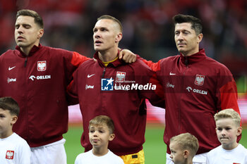 2024-10-12 - Jan Bednarek, Lukasz Skorupski, Robert Lewandowski of Poland during the UEFA Nations League, League A, Group A1 football match between Poland and Portugal on 12 October 2024 at PGE Narodowy in Warsaw, Poland - FOOTBALL - UEFA NATIONS LEAGUE - POLAND V PORTUGAL - UEFA NATIONS LEAGUE - SOCCER