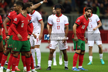 2024-10-12 - Maximillian Oyedele of Poland and Ruben Neves of Portugal during the UEFA Nations League, League A, Group A1 football match between Poland and Portugal on 12 October 2024 at PGE Narodowy in Warsaw, Poland - FOOTBALL - UEFA NATIONS LEAGUE - POLAND V PORTUGAL - UEFA NATIONS LEAGUE - SOCCER