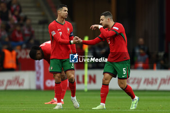 2024-10-12 - Cristiano Ronaldo, Diogo Dalot of Portugal during the UEFA Nations League, League A, Group A1 football match between Poland and Portugal on 12 October 2024 at PGE Narodowy in Warsaw, Poland - FOOTBALL - UEFA NATIONS LEAGUE - POLAND V PORTUGAL - UEFA NATIONS LEAGUE - SOCCER