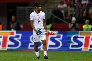 2024-10-12 - Maximillian Oyedele of Poland during the UEFA Nations League, League A, Group A1 football match between Poland and Portugal on 12 October 2024 at PGE Narodowy in Warsaw, Poland - FOOTBALL - UEFA NATIONS LEAGUE - POLAND V PORTUGAL - UEFA NATIONS LEAGUE - SOCCER