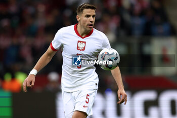 2024-10-12 - Jan Bednarek of Poland during the UEFA Nations League, League A, Group A1 football match between Poland and Portugal on 12 October 2024 at PGE Narodowy in Warsaw, Poland - FOOTBALL - UEFA NATIONS LEAGUE - POLAND V PORTUGAL - UEFA NATIONS LEAGUE - SOCCER