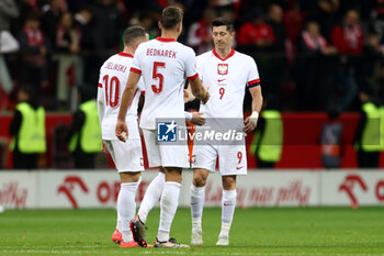 2024-10-12 - Piotr Zielinski, Jan Bednarek, Robert Lewandowski of Poland during the UEFA Nations League, League A, Group A1 football match between Poland and Portugal on 12 October 2024 at PGE Narodowy in Warsaw, Poland - FOOTBALL - UEFA NATIONS LEAGUE - POLAND V PORTUGAL - UEFA NATIONS LEAGUE - SOCCER