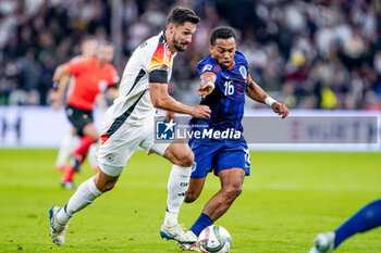 2024-10-14 - Tim Kleindienst of Germany battles for the ball with Quinten Timber of Netherlands during the UEFA Nations League, League A, Group 3 football match between Germany and Netherlands on October 14, 2024 at Allianz Arena in Munich, Germany - FOOTBALL - UEFA NATIONS LEAGUE - GERMANY V NETHERLANDS - UEFA NATIONS LEAGUE - SOCCER