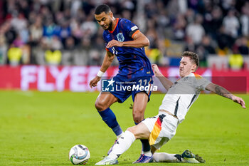 2024-10-14 - Cody Gakpo of Netherlands battles for the ball with Angelo Stiller of Germany during the UEFA Nations League, League A, Group 3 football match between Germany and Netherlands on October 14, 2024 at Allianz Arena in Munich, Germany - FOOTBALL - UEFA NATIONS LEAGUE - GERMANY V NETHERLANDS - UEFA NATIONS LEAGUE - SOCCER