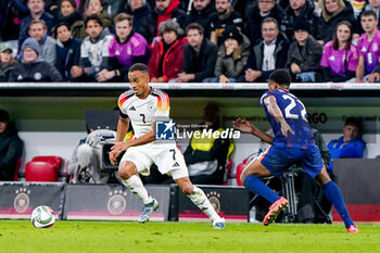 2024-10-14 - Jamie Leweling of Germany is challenged by Denzel Dumfries of Netherlands during the UEFA Nations League, League A, Group 3 football match between Germany and Netherlands on October 14, 2024 at Allianz Arena in Munich, Germany - FOOTBALL - UEFA NATIONS LEAGUE - GERMANY V NETHERLANDS - UEFA NATIONS LEAGUE - SOCCER