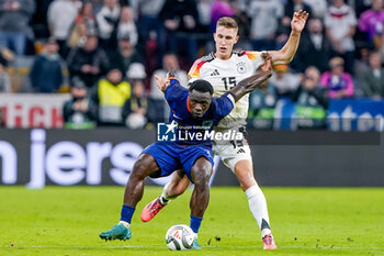 2024-10-14 - Brian Brobbey of Netherlands battles for the ball with Nico Schlotterbeck of Germany during the UEFA Nations League, League A, Group 3 football match between Germany and Netherlands on October 14, 2024 at Allianz Arena in Munich, Germany - FOOTBALL - UEFA NATIONS LEAGUE - GERMANY V NETHERLANDS - UEFA NATIONS LEAGUE - SOCCER