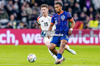 2024-10-14 - Quinten Timber of Netherlands is challenged by Angelo Stiller of Germany during the UEFA Nations League, League A, Group 3 football match between Germany and Netherlands on October 14, 2024 at Allianz Arena in Munich, Germany - FOOTBALL - UEFA NATIONS LEAGUE - GERMANY V NETHERLANDS - UEFA NATIONS LEAGUE - SOCCER