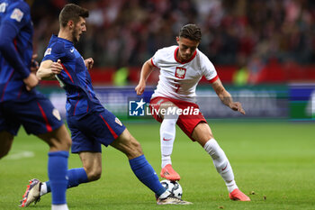 13/10/2024 - Kacper Urbanski of Poland and Petar Sucic of Croatia during the UEFA Nations League, League A, Group A1 football match between Poland and Croatia on 15 October 2024 at PGE Narodowy stadium in Warsaw, Poland - FOOTBALL - UEFA NATIONS LEAGUE - POLAND V CROATIA - UEFA NATIONS LEAGUE - CALCIO