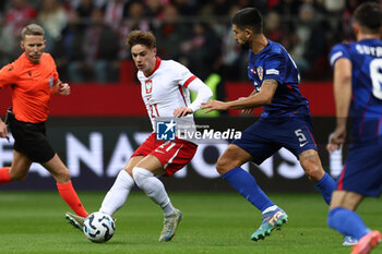 13/10/2024 - Nicola Zalewski of Poland and Martin Erlic of Croatia during the UEFA Nations League, League A, Group A1 football match between Poland and Croatia on 15 October 2024 at PGE Narodowy stadium in Warsaw, Poland - FOOTBALL - UEFA NATIONS LEAGUE - POLAND V CROATIA - UEFA NATIONS LEAGUE - CALCIO