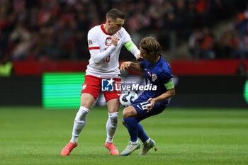 2024-10-15 - Piotr Zielinski of Poland and Luka Modric of Croatia during the UEFA Nations League, League A, Group A1 football match between Poland and Croatia on 15 October 2024 at PGE Narodowy stadium in Warsaw, Poland - FOOTBALL - UEFA NATIONS LEAGUE - POLAND V CROATIA - UEFA NATIONS LEAGUE - SOCCER