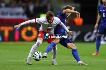 2024-10-15 - Nicola Zalewski of Poland and Luka Modric of Croatia during the UEFA Nations League, League A, Group A1 football match between Poland and Croatia on 15 October 2024 at PGE Narodowy stadium in Warsaw, Poland - FOOTBALL - UEFA NATIONS LEAGUE - POLAND V CROATIA - UEFA NATIONS LEAGUE - SOCCER