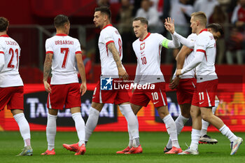 2024-10-15 - Jakub Moder, Piotr Zielinski, Karol Swiderski of Poland during the UEFA Nations League, League A, Group A1 football match between Poland and Croatia on 15 October 2024 at PGE Narodowy stadium in Warsaw, Poland - FOOTBALL - UEFA NATIONS LEAGUE - POLAND V CROATIA - UEFA NATIONS LEAGUE - SOCCER