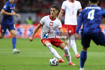 2024-10-15 - Kacper Urbanski of Poland during the UEFA Nations League, League A, Group A1 football match between Poland and Croatia on 15 October 2024 at PGE Narodowy stadium in Warsaw, Poland - FOOTBALL - UEFA NATIONS LEAGUE - POLAND V CROATIA - UEFA NATIONS LEAGUE - SOCCER