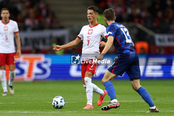 2024-10-15 - Kacper Urbanski of Poland during the UEFA Nations League, League A, Group A1 football match between Poland and Croatia on 15 October 2024 at PGE Narodowy stadium in Warsaw, Poland - FOOTBALL - UEFA NATIONS LEAGUE - POLAND V CROATIA - UEFA NATIONS LEAGUE - SOCCER