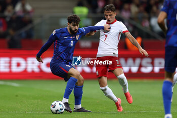 2024-10-15 - Josko Gvardiol of Croatia and Kacper Urbanski of Poland during the UEFA Nations League, League A, Group A1 football match between Poland and Croatia on 15 October 2024 at PGE Narodowy stadium in Warsaw, Poland - FOOTBALL - UEFA NATIONS LEAGUE - POLAND V CROATIA - UEFA NATIONS LEAGUE - SOCCER