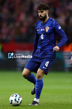 2024-10-15 - Josko Gvardiol of Croatia during the UEFA Nations League, League A, Group A1 football match between Poland and Croatia on 15 October 2024 at PGE Narodowy stadium in Warsaw, Poland - FOOTBALL - UEFA NATIONS LEAGUE - POLAND V CROATIA - UEFA NATIONS LEAGUE - SOCCER