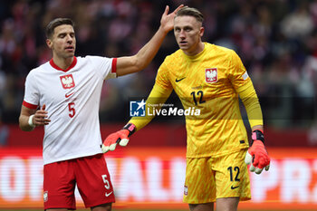 2024-10-15 - Jan Bednarek, Marcin Bulka of Poland during the UEFA Nations League, League A, Group A1 football match between Poland and Croatia on 15 October 2024 at PGE Narodowy stadium in Warsaw, Poland - FOOTBALL - UEFA NATIONS LEAGUE - POLAND V CROATIA - UEFA NATIONS LEAGUE - SOCCER