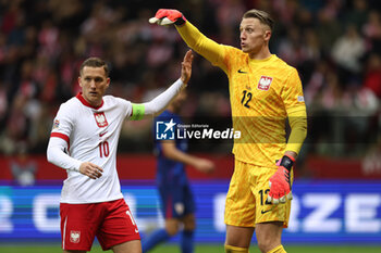 2024-10-15 - Piotr Zielinski, Marcin Bulka of Poland during the UEFA Nations League, League A, Group A1 football match between Poland and Croatia on 15 October 2024 at PGE Narodowy stadium in Warsaw, Poland - FOOTBALL - UEFA NATIONS LEAGUE - POLAND V CROATIA - UEFA NATIONS LEAGUE - SOCCER