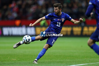 2024-10-15 - Petar Sucic of Croatia during the UEFA Nations League, League A, Group A1 football match between Poland and Croatia on 15 October 2024 at PGE Narodowy stadium in Warsaw, Poland - FOOTBALL - UEFA NATIONS LEAGUE - POLAND V CROATIA - UEFA NATIONS LEAGUE - SOCCER