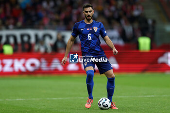 2024-10-15 - Josip Sutalo of Croatia during the UEFA Nations League, League A, Group A1 football match between Poland and Croatia on 15 October 2024 at PGE Narodowy stadium in Warsaw, Poland - FOOTBALL - UEFA NATIONS LEAGUE - POLAND V CROATIA - UEFA NATIONS LEAGUE - SOCCER