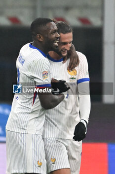 17/11/2024 - Adrien Rabiot of France and Marcus Thuram of France celebrating after a goal during the Group A2 - UEFA NATIONS LEAGUE 2024 match between Italy and France on 17 of November 2024 at Giuseppe Meazza San Siro Siro stadium in Milan, Italy. - ITALY VS FRANCE - UEFA NATIONS LEAGUE - CALCIO