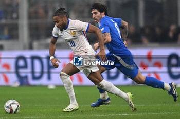 17/11/2024 - Sandro Tonali of Italy and Christopher Nkunku of France during the Group A2 - UEFA NATIONS LEAGUE 2024 match between Italy and France on 17 of November 2024 at Giuseppe Meazza San Siro Siro stadium in Milan, Italy. - ITALY VS FRANCE - UEFA NATIONS LEAGUE - CALCIO