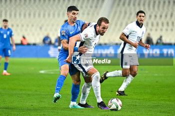 14/11/2024 - 9 Harry Kane of England competes with 20 Petros Mantalos of Greece during the UEFA Nations League 2024/25 League B, Group B2 match between Greece and England on November 14, 2024 at OAKA Stadium, in Athens, Greece. - GREECE VS ENGLAND - UEFA NATIONS LEAGUE - CALCIO