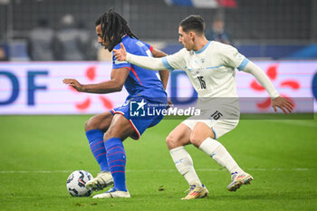 14/11/2024 - Jules KOUNDE of France and Oscar GLOUKH of Israel during the UEFA Nations League, League A, Group A2 football match between France and Israel on 14 November 2024 at Stade de France in Saint-Denis near Paris, France - FOOTBALL - UEFA NATIONS LEAGUE - FRANCE V ISRAEL - UEFA NATIONS LEAGUE - CALCIO