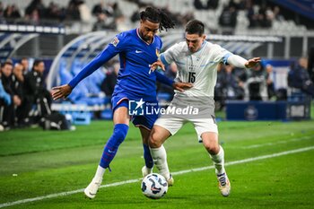 14/11/2024 - Michael OLISE of France and Oscar GLOUKH of Israel during the UEFA Nations League, League A, Group A2 football match between France and Israel on 14 November 2024 at Stade de France in Saint-Denis near Paris, France - FOOTBALL - UEFA NATIONS LEAGUE - FRANCE V ISRAEL - UEFA NATIONS LEAGUE - CALCIO