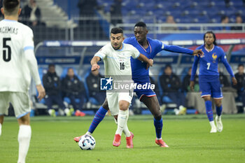 14/11/2024 - Mohammad Abu Fani of Israel, Randal Kolo Muani of France during the UEFA Nations League, League A, Group A2 football match between France and Israel on 14 November 2024 at Stade de France in Saint-Denis near Paris, France - FOOTBALL - UEFA NATIONS LEAGUE - FRANCE V ISRAEL - UEFA NATIONS LEAGUE - CALCIO