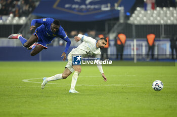 14/11/2024 - Randal Kolo Muani of France, Mahmoud Jaber of Israel during the UEFA Nations League, League A, Group A2 football match between France and Israel on 14 November 2024 at Stade de France in Saint-Denis near Paris, France - FOOTBALL - UEFA NATIONS LEAGUE - FRANCE V ISRAEL - UEFA NATIONS LEAGUE - CALCIO