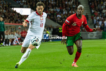 2024-11-15 - Bartosz Bereszynski of Poland and Nuno Mendes of Portugal during the UEFA Nations League, League phase, Matchday 5 football match between Portugal and Poland on 15 November 2024 at Estádio do Dragão in Porto, Portugal - FOOTBALL - UEFA NATIONS LEAGUE - PORTUGAL V POLAND - UEFA NATIONS LEAGUE - SOCCER