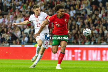 2024-11-15 - Renato Veiga of Portugal and Krzysztof Piatek of Poland during the UEFA Nations League, League phase, Matchday 5 football match between Portugal and Poland on 15 November 2024 at Estádio do Dragão in Porto, Portugal - FOOTBALL - UEFA NATIONS LEAGUE - PORTUGAL V POLAND - UEFA NATIONS LEAGUE - SOCCER