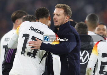 2024-11-16 - Felix Nmecha of Germany and Head Coach Julian Nagelsmann of Germany celebrate during the UEFA Nations League, League phase, Matchday 5 football match between Germany and Bosnia Herzegovina on 16 November 2024 at Europa-Park Stadion in Freiburg, Germany - FOOTBALL - UEFA NATIONS LEAGUE - GERMANY V BOSNIA HERZEGOVINA - UEFA NATIONS LEAGUE - SOCCER