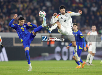 2024-11-16 - Tarik Muharemovic of Bosnia Herzegovina and Tim Kleindienst of Germany during the UEFA Nations League, League phase, Matchday 5 football match between Germany and Bosnia Herzegovina on 16 November 2024 at Europa-Park Stadion in Freiburg, Germany - FOOTBALL - UEFA NATIONS LEAGUE - GERMANY V BOSNIA HERZEGOVINA - UEFA NATIONS LEAGUE - SOCCER