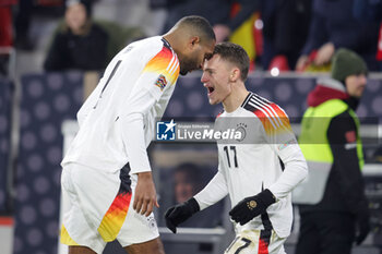 2024-11-16 - Florian Wirtz of Germany celebrates his goal 4-0 with Jonathan Tah during the UEFA Nations League, League phase, Matchday 5 football match between Germany and Bosnia Herzegovina on 16 November 2024 at Europa-Park Stadion in Freiburg, Germany - FOOTBALL - UEFA NATIONS LEAGUE - GERMANY V BOSNIA HERZEGOVINA - UEFA NATIONS LEAGUE - SOCCER