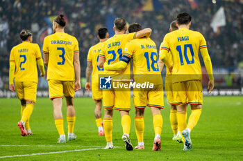 18/11/2024 - Darius Olaru of Romania hugs Razvan Marin of Romania after he scores his team's second goal to make the score 2-0 during the UEFA Nations League, League C, Group C2 football match between Romania and Cyprus on 18 November 2024 at Arena Nationala in Bucharest, Romania - FOOTBALL - UEFA NATIONS LEAGUE - ROMANIA V CYPRUS - UEFA NATIONS LEAGUE - CALCIO