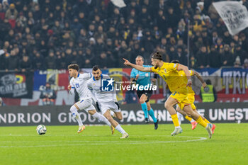 18/11/2024 - Marinos Tzionis of Cyprus, Ioannis Pittas of Cyprus and Radu Dragusin of Romania in action during the UEFA Nations League, League C, Group C2 football match between Romania and Cyprus on 18 November 2024 at Arena Nationala in Bucharest, Romania - FOOTBALL - UEFA NATIONS LEAGUE - ROMANIA V CYPRUS - UEFA NATIONS LEAGUE - CALCIO