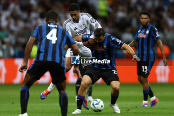 2024-08-14 - Jude Bellingham of Real Madrid and Sead Kolasinac of Atalanta during the UEFA Super Cup 2024 football match between Real Madrid CF and Atalanta BC on 14 August 2024 at PGE Narodowy in Warsaw, Poland - FOOTBALL - UEFA SUPER CUP 2024 - REAL MADRID V ATALANTA - UEFA SUPER CUP - SOCCER