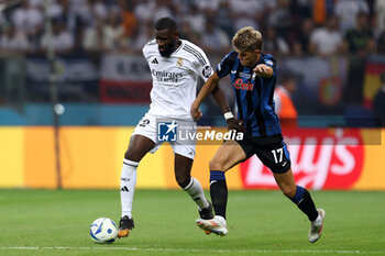 2024-08-14 - Antonio Rudiger of Real Madrid and Charles De Ketelaere of Atalanta during the UEFA Super Cup 2024 football match between Real Madrid CF and Atalanta BC on 14 August 2024 at PGE Narodowy in Warsaw, Poland - FOOTBALL - UEFA SUPER CUP 2024 - REAL MADRID V ATALANTA - UEFA SUPER CUP - SOCCER