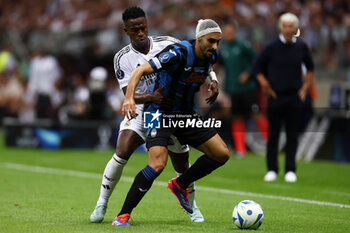 2024-08-14 - Vinicius Junior of Real Madrid and Davide Zappacosta of Atalanta during the UEFA Super Cup 2024 football match between Real Madrid CF and Atalanta BC on 14 August 2024 at PGE Narodowy in Warsaw, Poland - FOOTBALL - UEFA SUPER CUP 2024 - REAL MADRID V ATALANTA - UEFA SUPER CUP - SOCCER