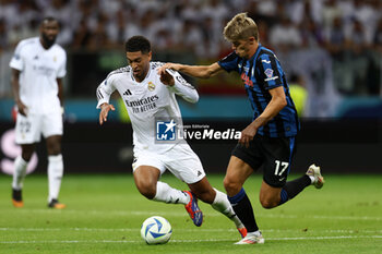 2024-08-14 - Jude Bellingham of Real Madrid and Charles De Ketelaere of Atalanta during the UEFA Super Cup 2024 football match between Real Madrid CF and Atalanta BC on 14 August 2024 at PGE Narodowy in Warsaw, Poland - FOOTBALL - UEFA SUPER CUP 2024 - REAL MADRID V ATALANTA - UEFA SUPER CUP - SOCCER