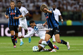 2024-08-14 - Jude Bellingham of Real Madrid and Charles De Ketelaere of Atalanta during the UEFA Super Cup 2024 football match between Real Madrid CF and Atalanta BC on 14 August 2024 at PGE Narodowy in Warsaw, Poland - FOOTBALL - UEFA SUPER CUP 2024 - REAL MADRID V ATALANTA - UEFA SUPER CUP - SOCCER