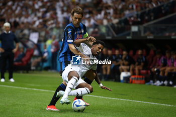 2024-08-14 - Marten de Roon of Atalanta and Rodrygo of Real Madrid during the UEFA Super Cup 2024 football match between Real Madrid CF and Atalanta BC on 14 August 2024 at PGE Narodowy in Warsaw, Poland - FOOTBALL - UEFA SUPER CUP 2024 - REAL MADRID V ATALANTA - UEFA SUPER CUP - SOCCER