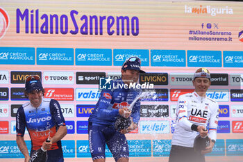 2024-03-16 - Cycling, Milano - Sanremo, 16-03-2024, Sanremo, in the photo: podium oper the bottle - MILANO - SAN REMO - STREET - CYCLING