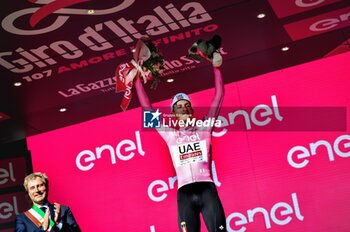 2024-05-08 - SLO Tadej Pogacar UAE - On the podium wear the Maglia Rosa Jersey - STAGE 5 - GENOVA-LUCCA - GIRO D'ITALIA - CYCLING